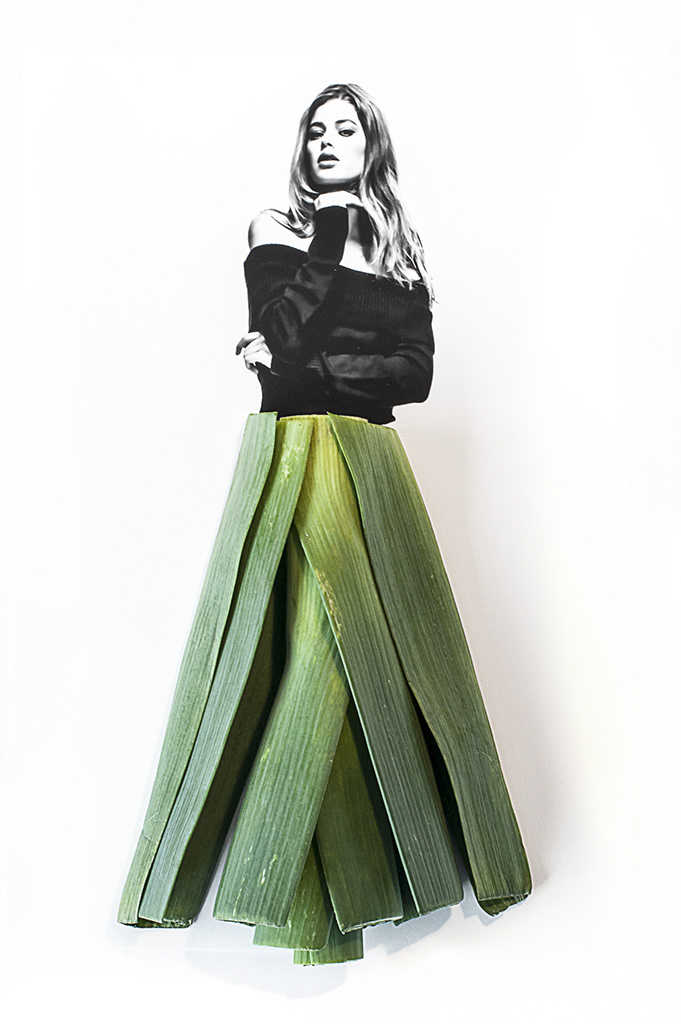 photograph of model Doutzen with a dress of leek leaves